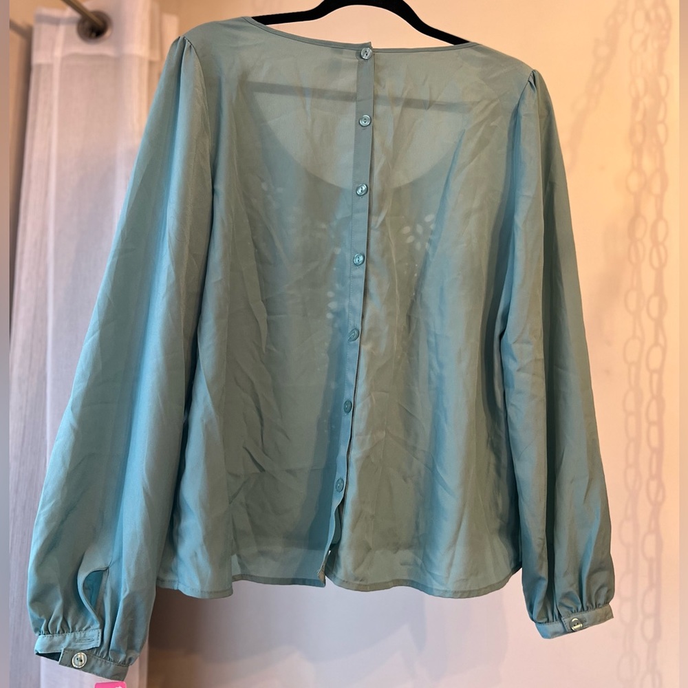 Beautiful teal blouse, eyelet design on front, full functioning buttons on back